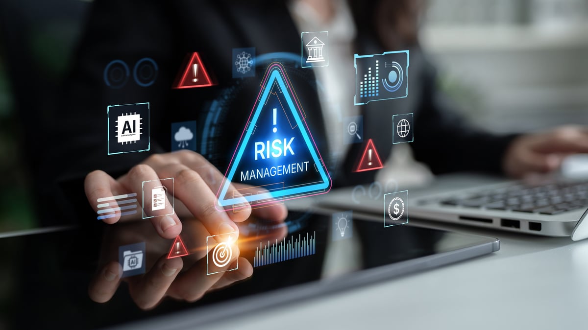 A business professional analyzes risk management strategies on a digital interface in a contemporary workplace